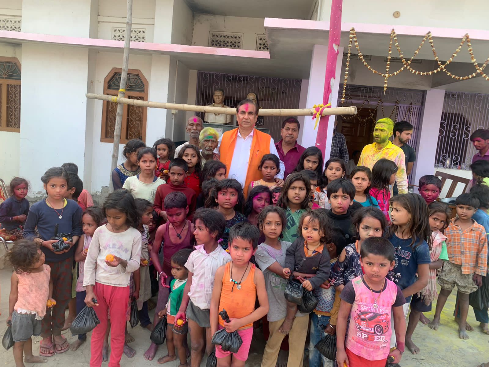 A. P. Pathak distributed grains and sweets among the children
